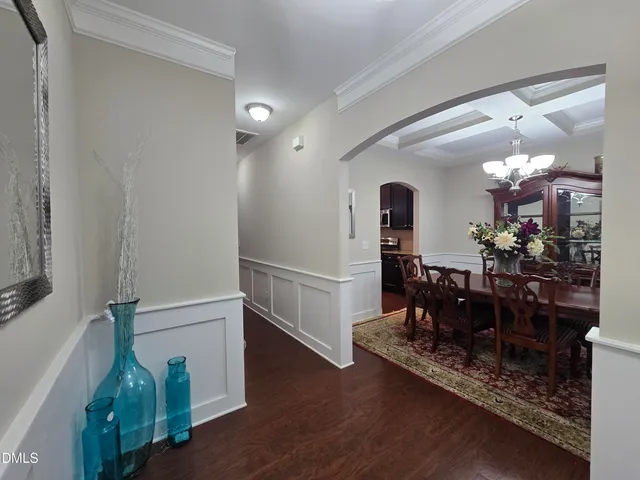 a view of a dining room with furniture and wooden floor