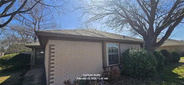 a view of a house with a tree