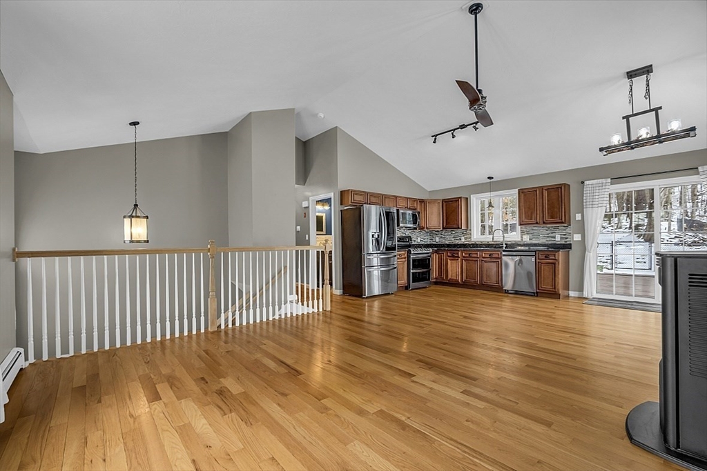 535 Clark Street Gardner, MA 01440 - Photo 13 of 41 a view of a kitchen with kitchen island a counter space a sink and appliances