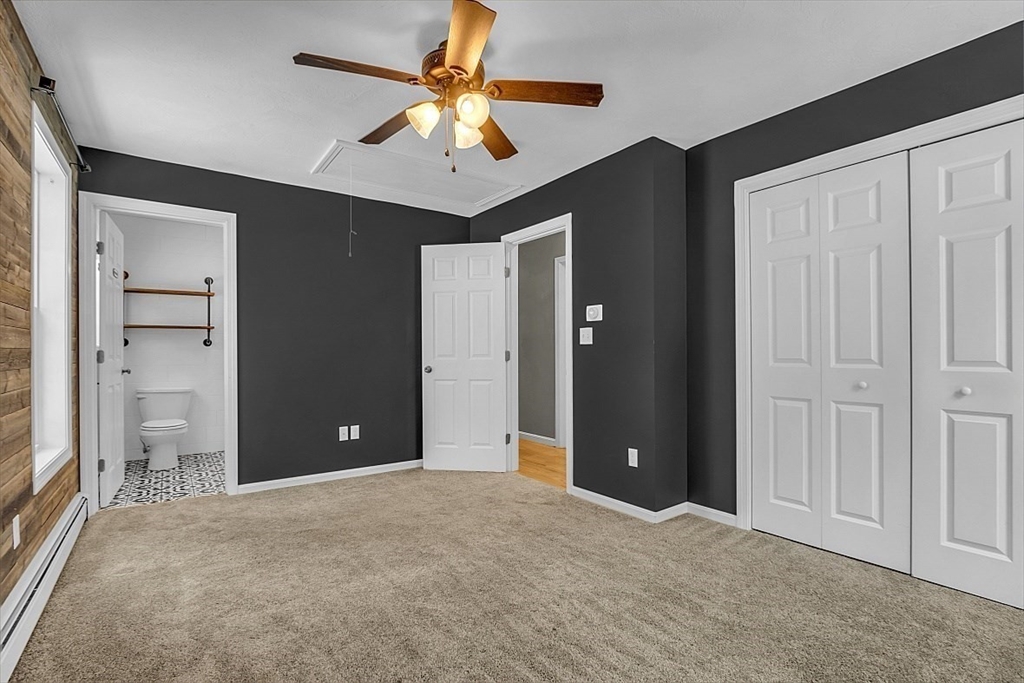 535 Clark Street Gardner, MA 01440 - Photo 19 of 41 wooden floor and an empty room with a ceiling fan