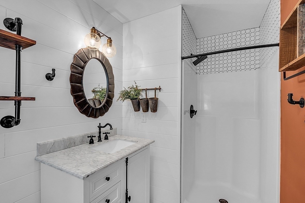 535 Clark Street Gardner, MA 01440 - Photo 20 of 41 a bathroom with a sink and a mirror