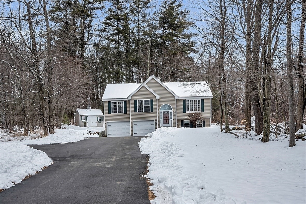 535 Clark Street Gardner, MA 01440 - Photo 2 of 41 a house with a large tree in front of it