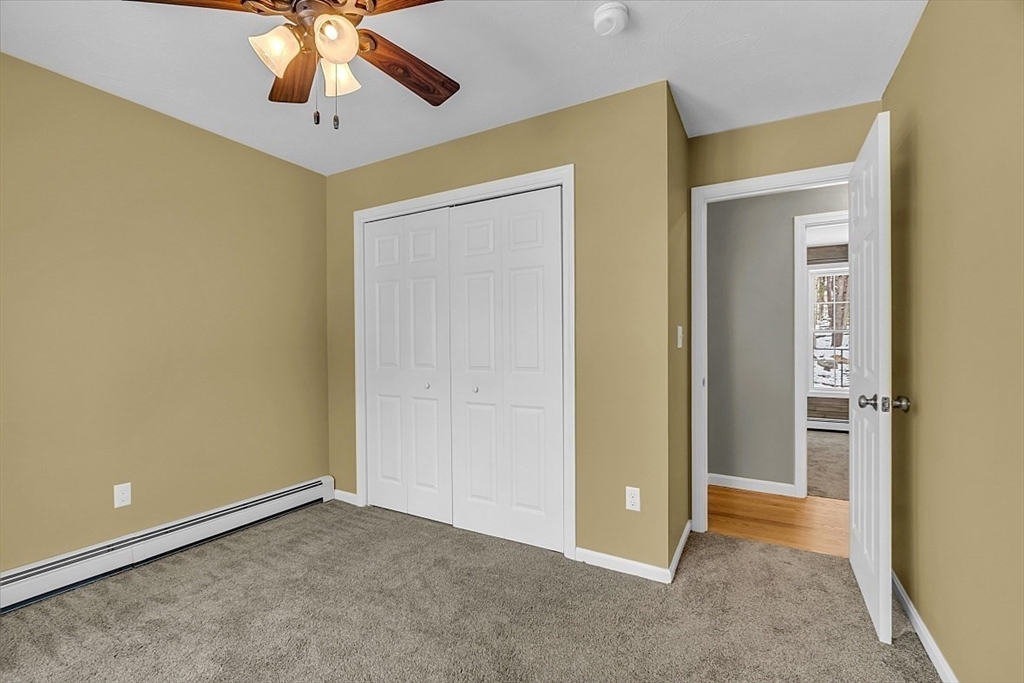 535 Clark Street Gardner, MA 01440 - Photo 23 of 41 an empty room and chandelier fan