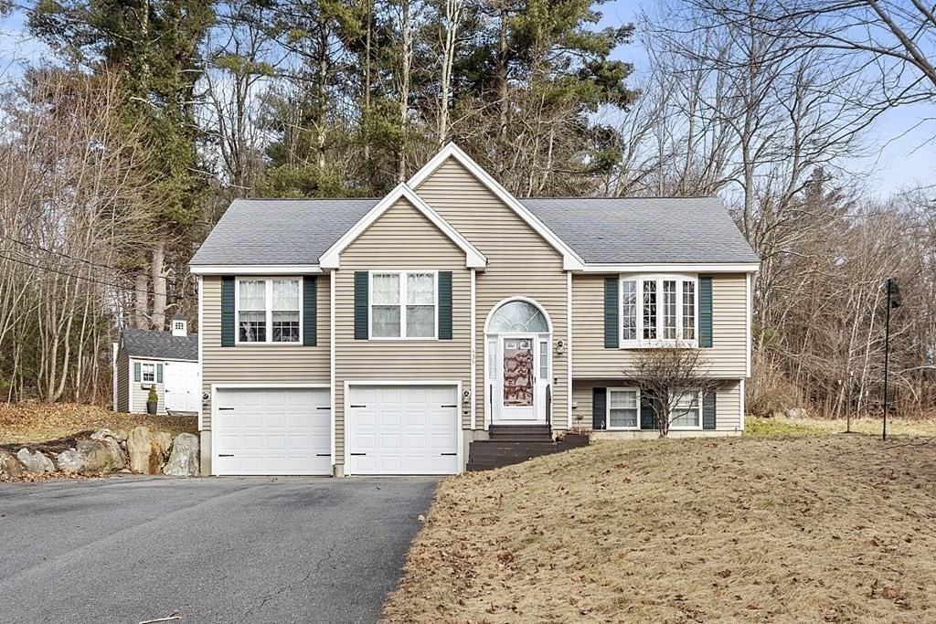 535 Clark Street Gardner, MA 01440 - Photo 38 of 41 a house that has a tree in front of it with a tree