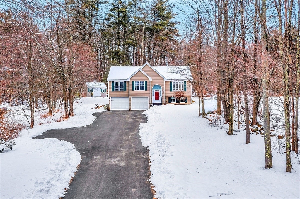 535 Clark Street Gardner, MA 01440 - Photo 40 of 41 a front view of a house with a yard covered in snow