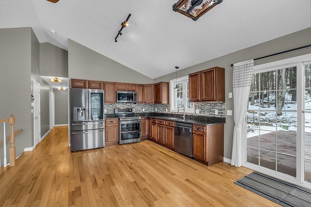 535 Clark Street Gardner, MA 01440 - Photo 5 of 41 a kitchen with stainless steel appliances kitchen island granite countertop a refrigerator stove and oven
