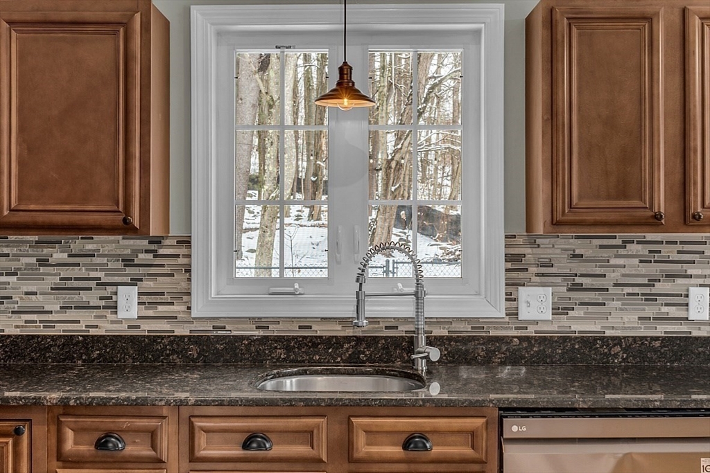535 Clark Street Gardner, MA 01440 - Photo 8 of 41 a kitchen with stainless steel appliances granite countertop a sink and a granite counter tops