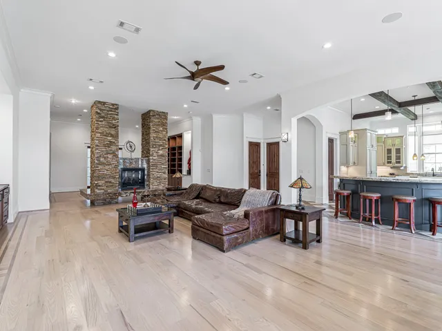 a kitchen with stainless steel appliances granite countertop a stove and cabinets