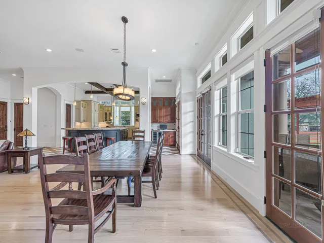 a kitchen with chairs and wooden chairs