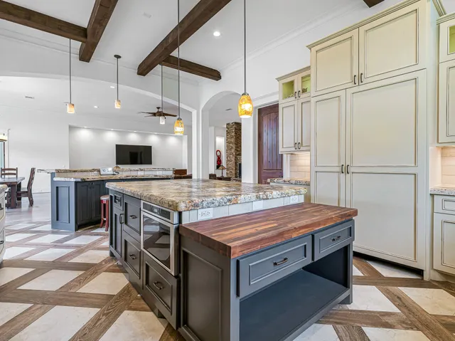 a spacious bathroom with a double vanity sink a mirror and a bathtub