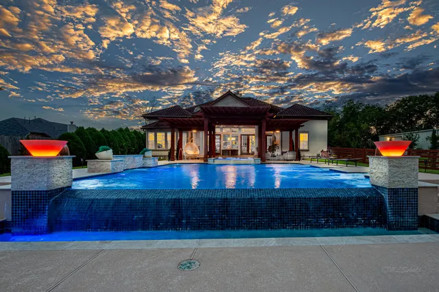 a view of a backyard of the house