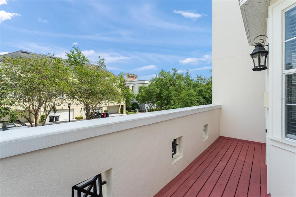 1563 Common Way Road Orlando, FL 32814 - Photo 34 of 47 a view of a balcony with wooden floor and fence