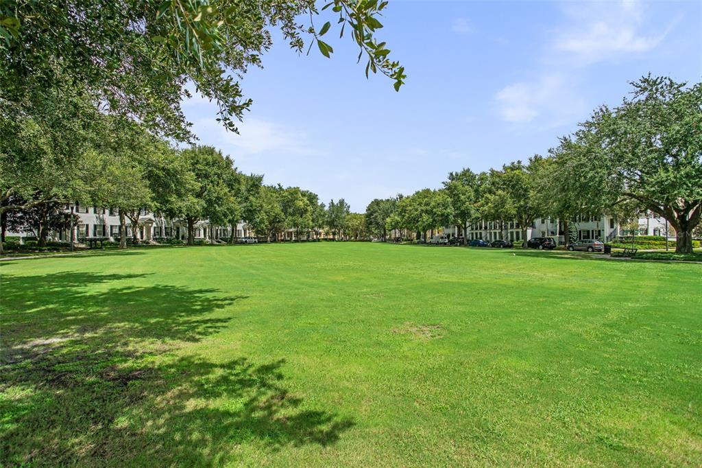 1563 Common Way Road Orlando, FL 32814 - Photo 38 of 47 a view of green field with tree in the background