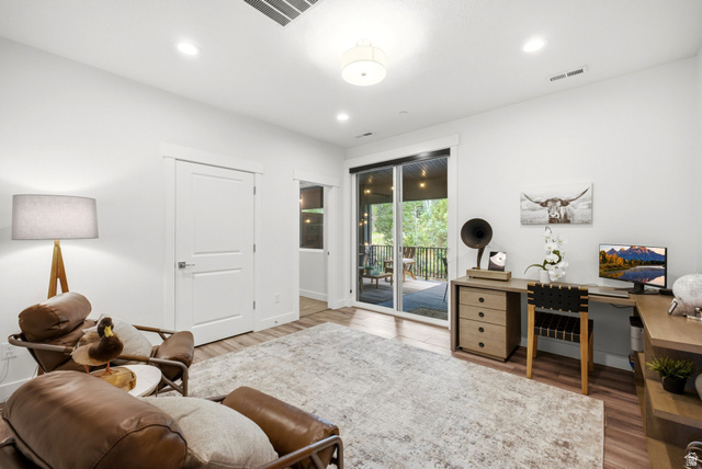 3355 Santa Fe Road Park City, UT 84098 - Photo 12 of 45 Bright interior space featuring wood-finish flooring and a glass sliding door leading to an outdoor deck