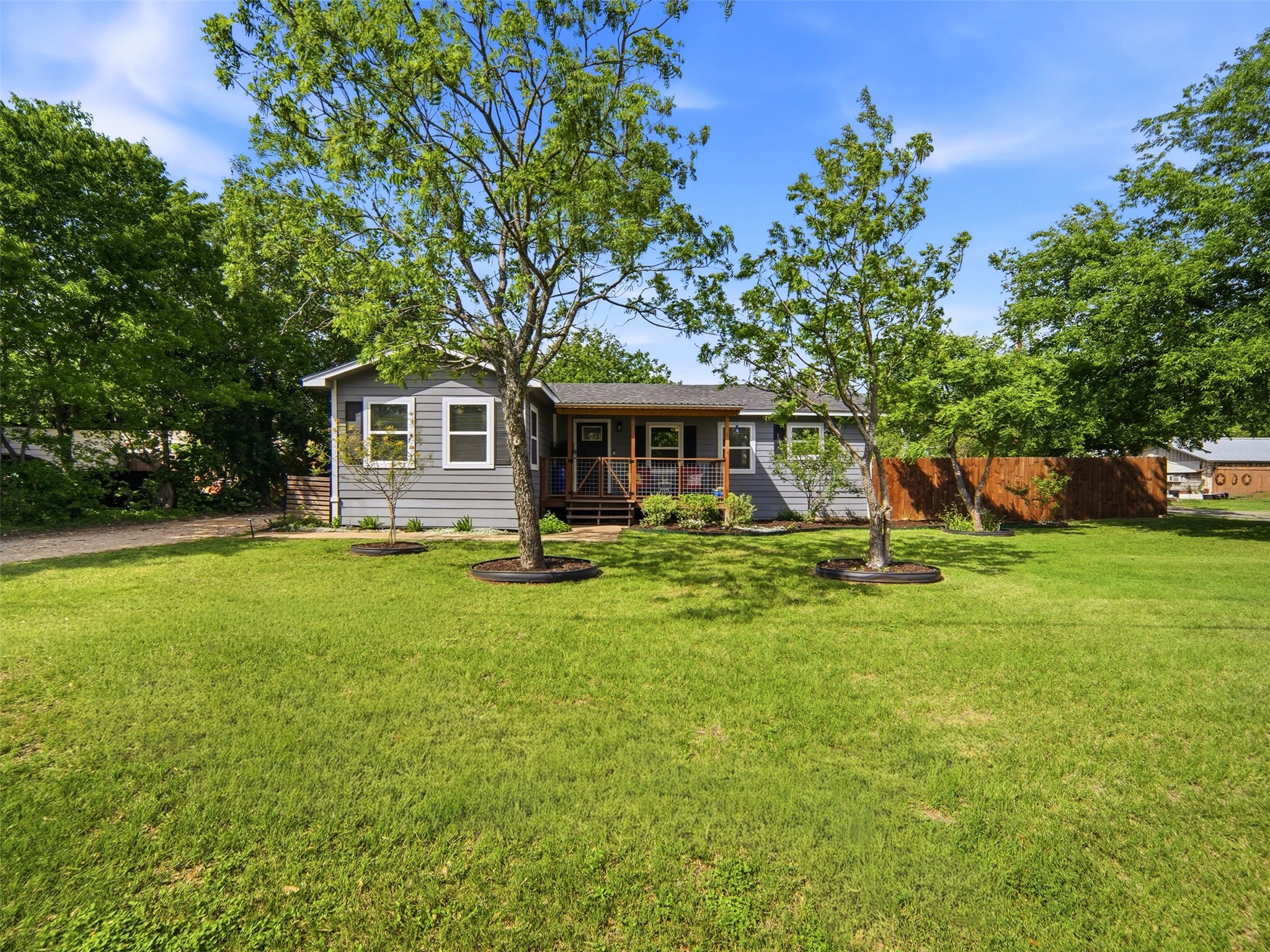 700 9th Street Blanco, TX 78606 - Photo 32 of 33 a front view of a house with yard and green space