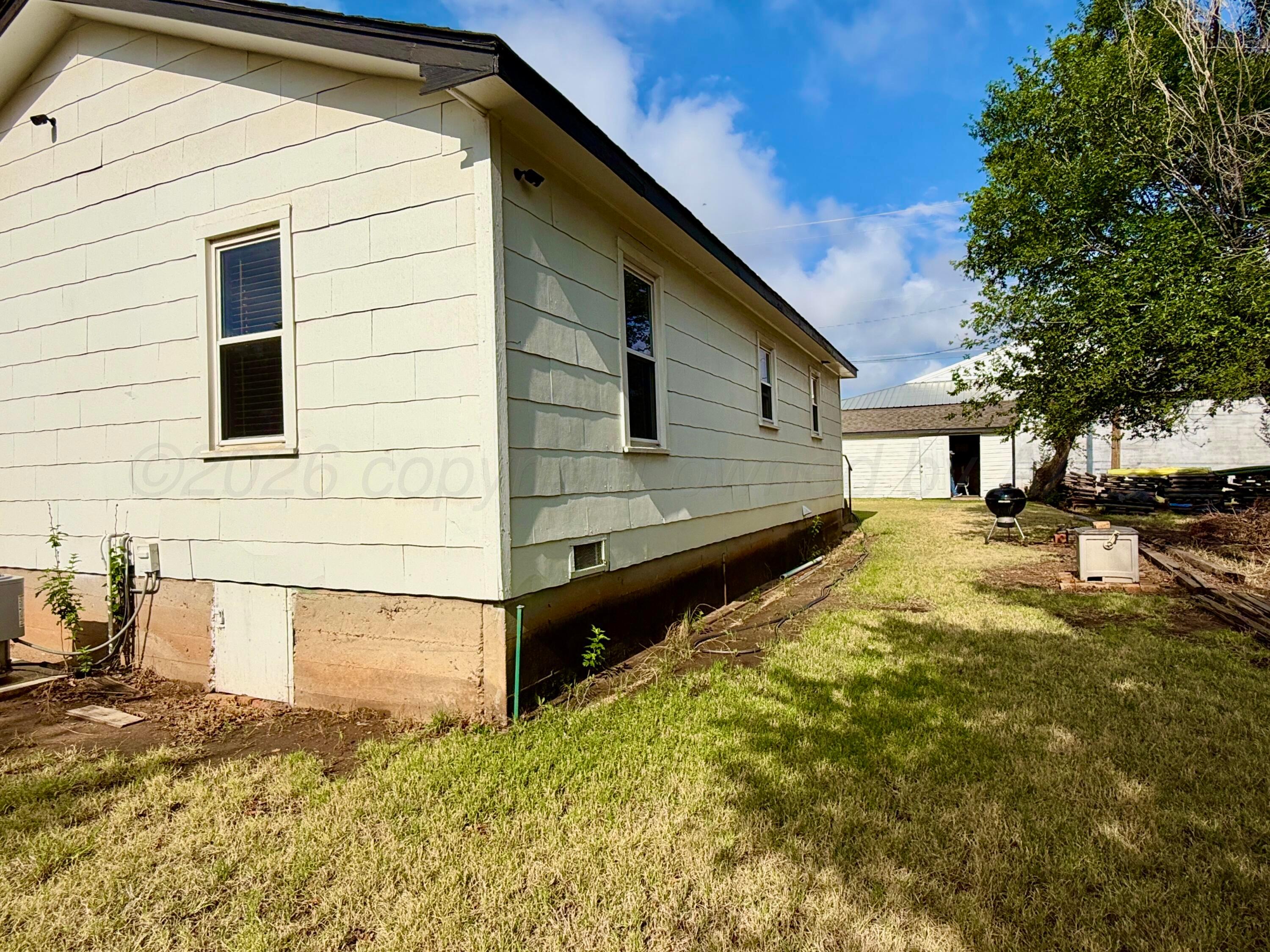 701 Brain Street Borger, TX 79007 - Photo 6 of 18 a front view of a house with a yard