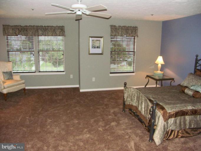 4264 Maple Path Circle, Unit 4 Nottingham, MD 21236 - Photo 11 of 17 a living room with furniture and a chandelier