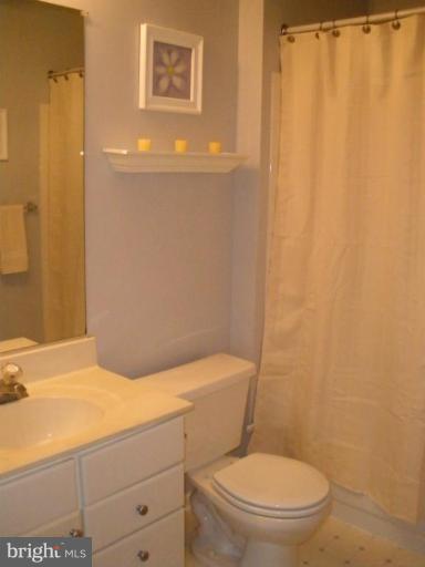 4264 Maple Path Circle, Unit 4 Nottingham, MD 21236 - Photo 12 of 17 a white toilet sitting next to a small bathroom