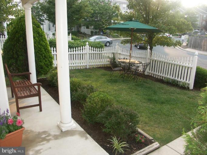 4264 Maple Path Circle, Unit 4 Nottingham, MD 21236 - Photo 14 of 17 a view of a porch with a garden