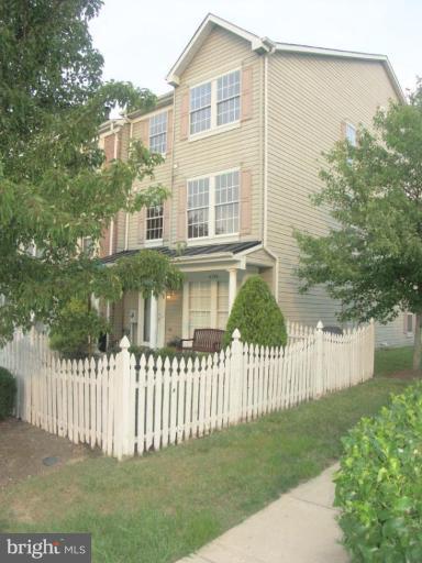 4264 Maple Path Circle, Unit 4 Nottingham, MD 21236 - Photo 15 of 17 a front view of a house with a garden