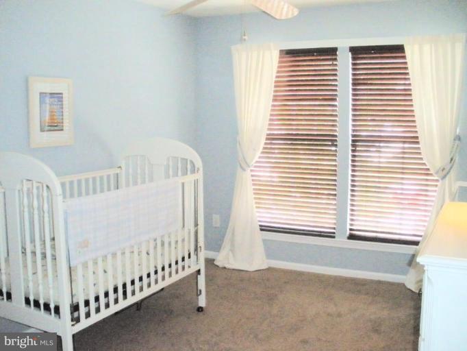 4264 Maple Path Circle, Unit 4 Nottingham, MD 21236 - Photo 16 of 17 a view of a bedroom with windows