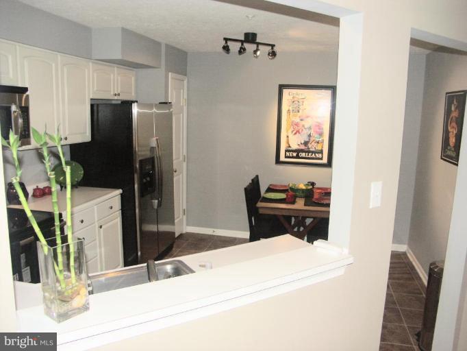 4264 Maple Path Circle, Unit 4 Nottingham, MD 21236 - Photo 3 of 17 a kitchen with a refrigerator and a stove