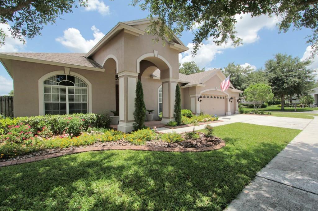 19134 Wind Dancer Street Lutz, FL 33558 - Photo 1 of 1 a front view of house and yard with green space