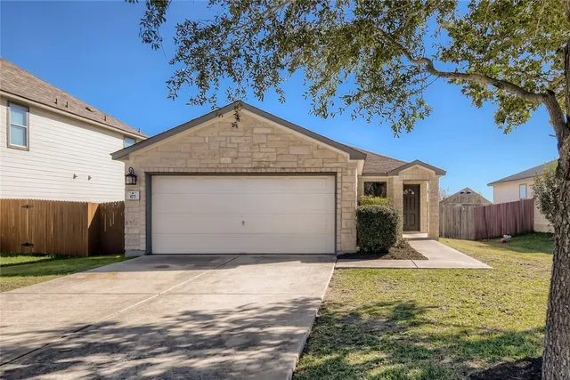 a view of a backyard of the house