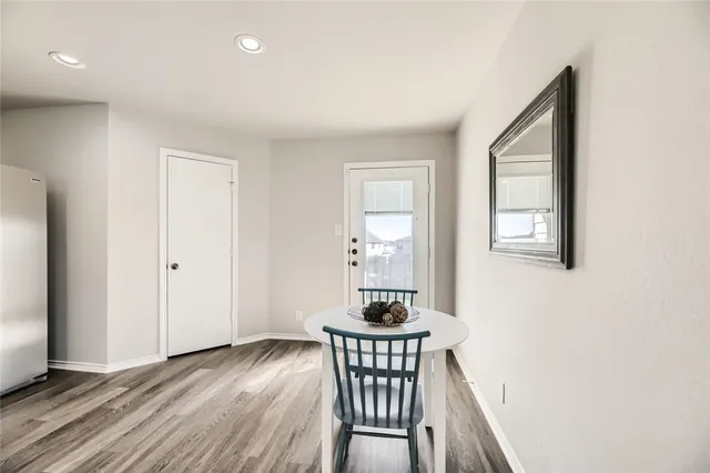 a view of a dining room with furniture and window