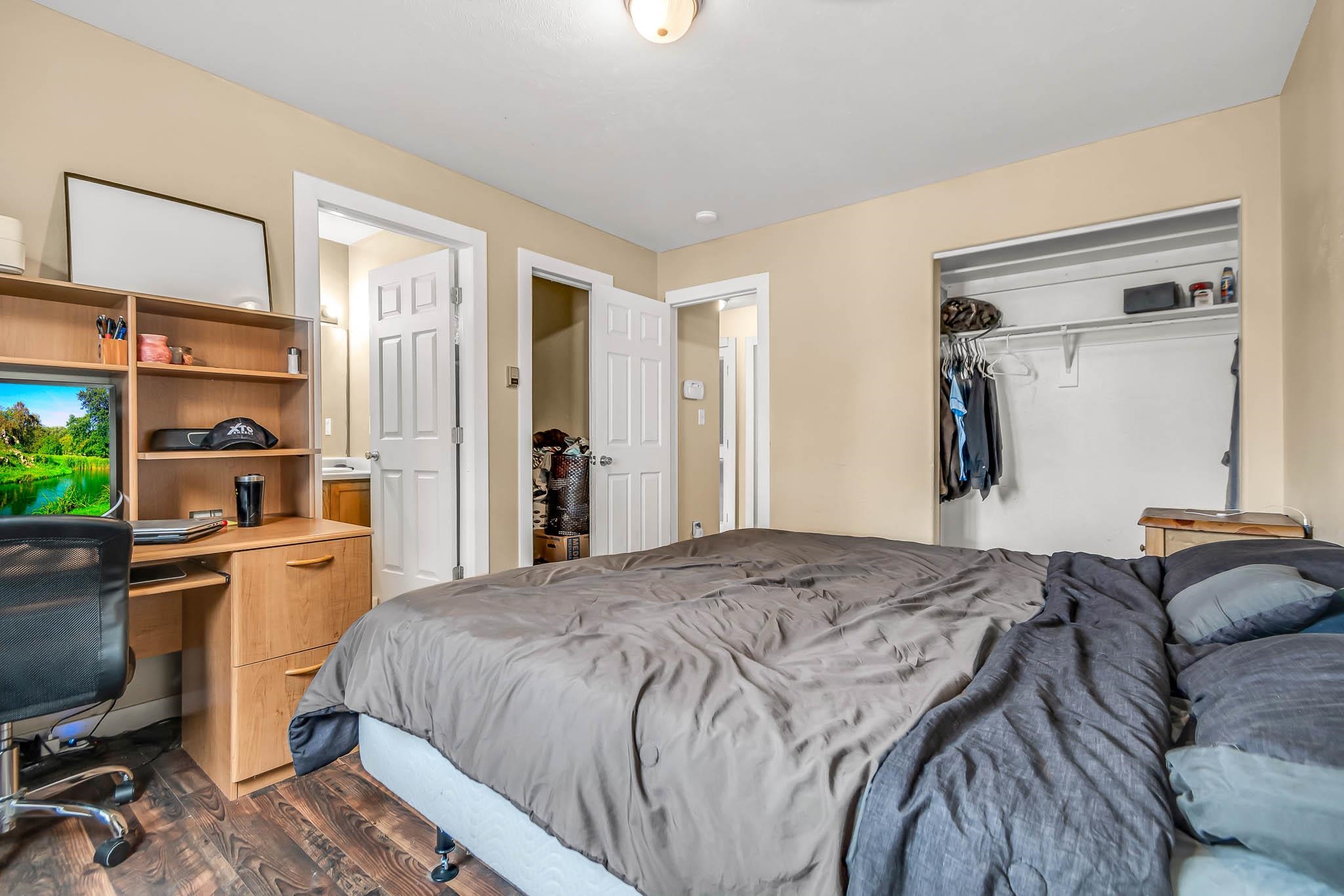 389 Sunnyside Circle, Unit A Grand Junction, CO 81504 - Photo 14 of 21 a bedroom with a bed and a desk