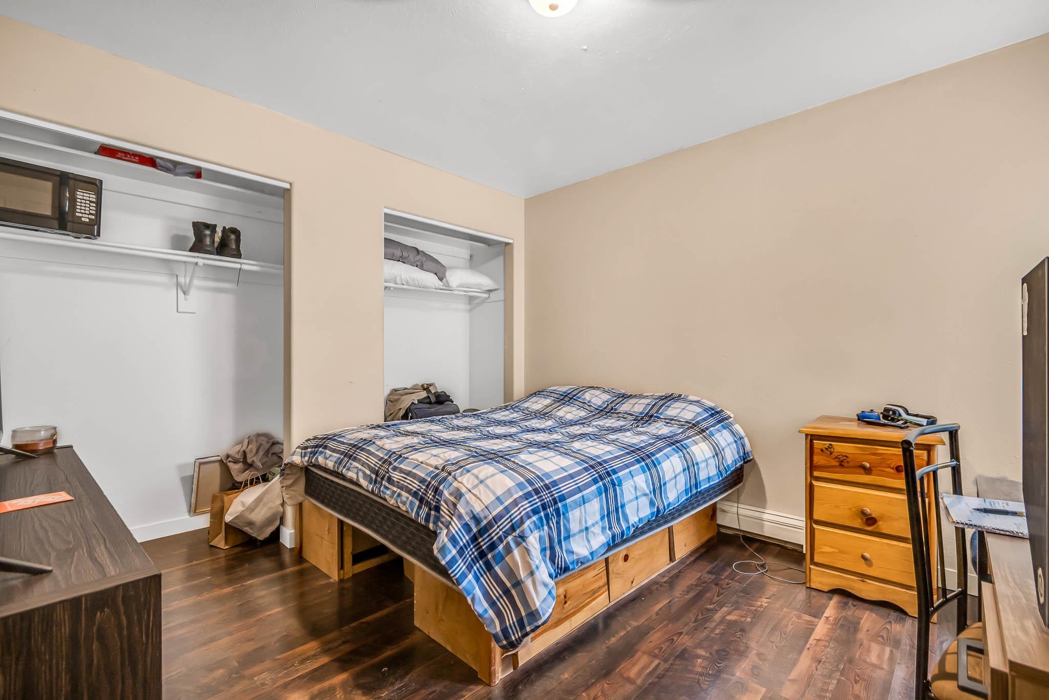 389 Sunnyside Circle, Unit A Grand Junction, CO 81504 - Photo 17 of 21 a bed sitting in a bedroom next to a window