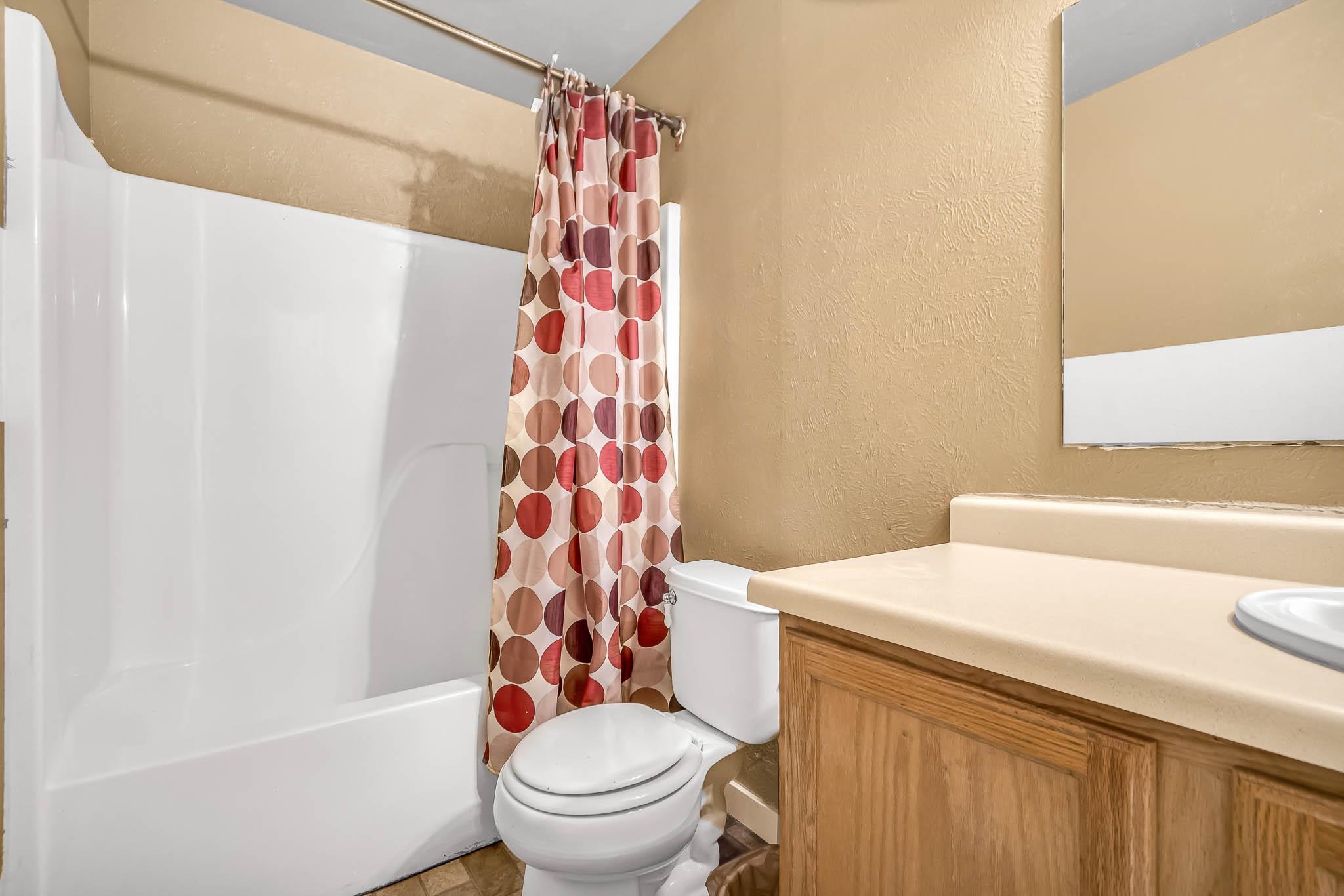 389 Sunnyside Circle, Unit A Grand Junction, CO 81504 - Photo 18 of 21 a bathroom with a sink toilet and shower