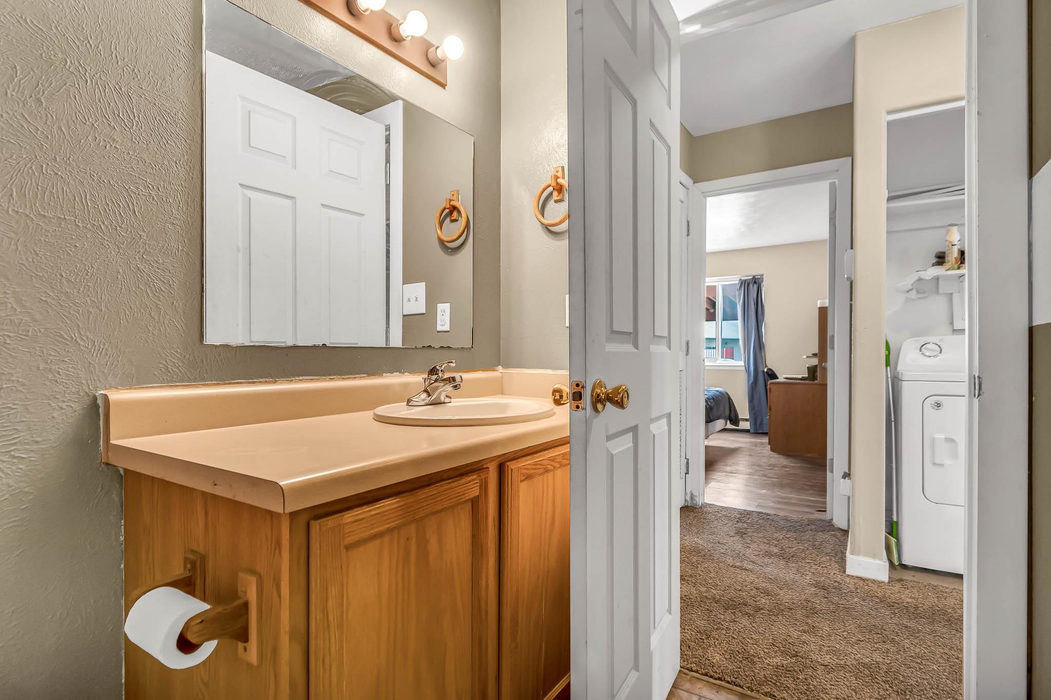 389 Sunnyside Circle, Unit A Grand Junction, CO 81504 - Photo 19 of 21 a bathroom with a sink vanity and a mirror