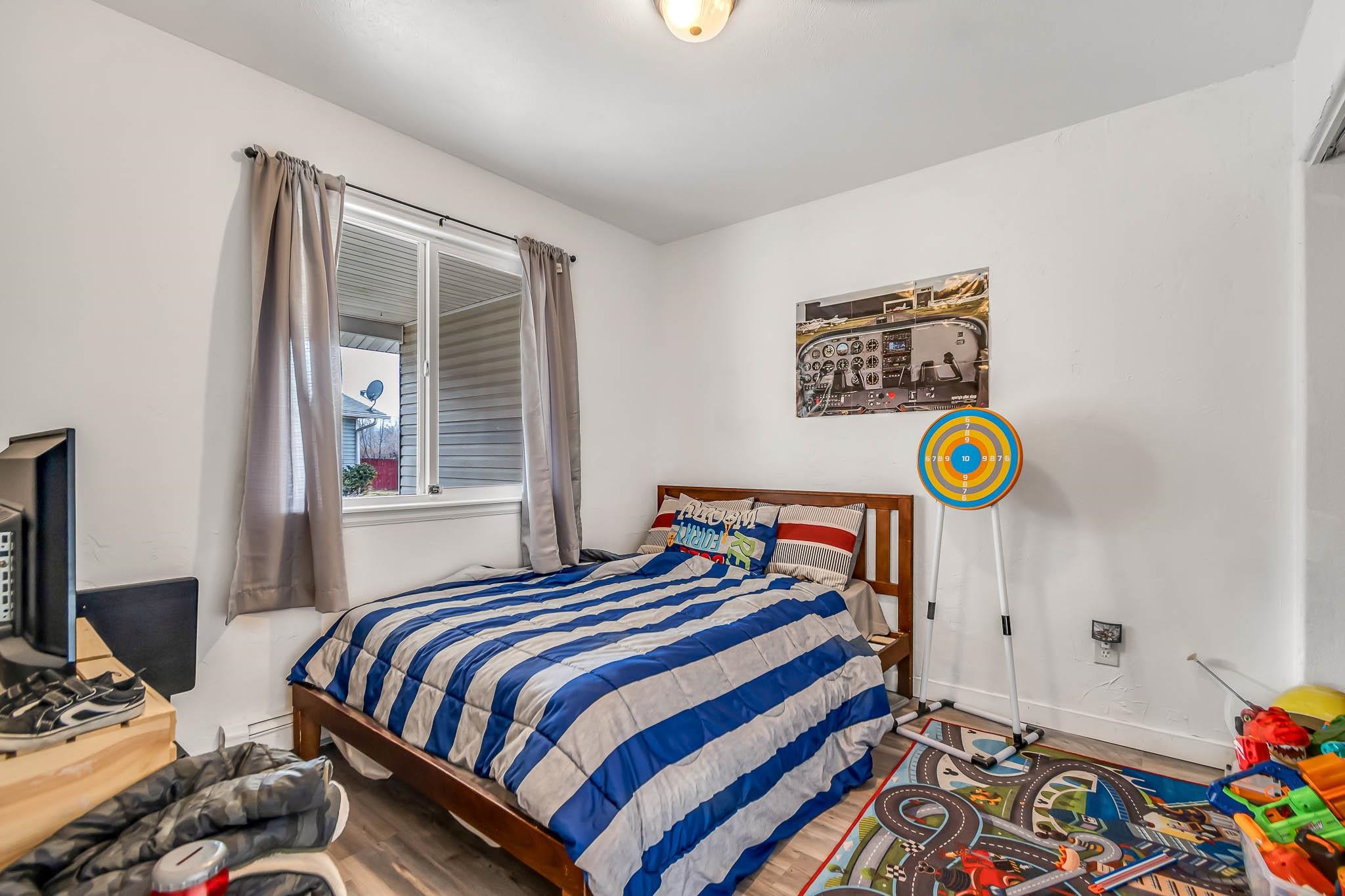 389 Sunnyside Circle, Unit A Grand Junction, CO 81504 - Photo 20 of 21 a bedroom with bed and a window
