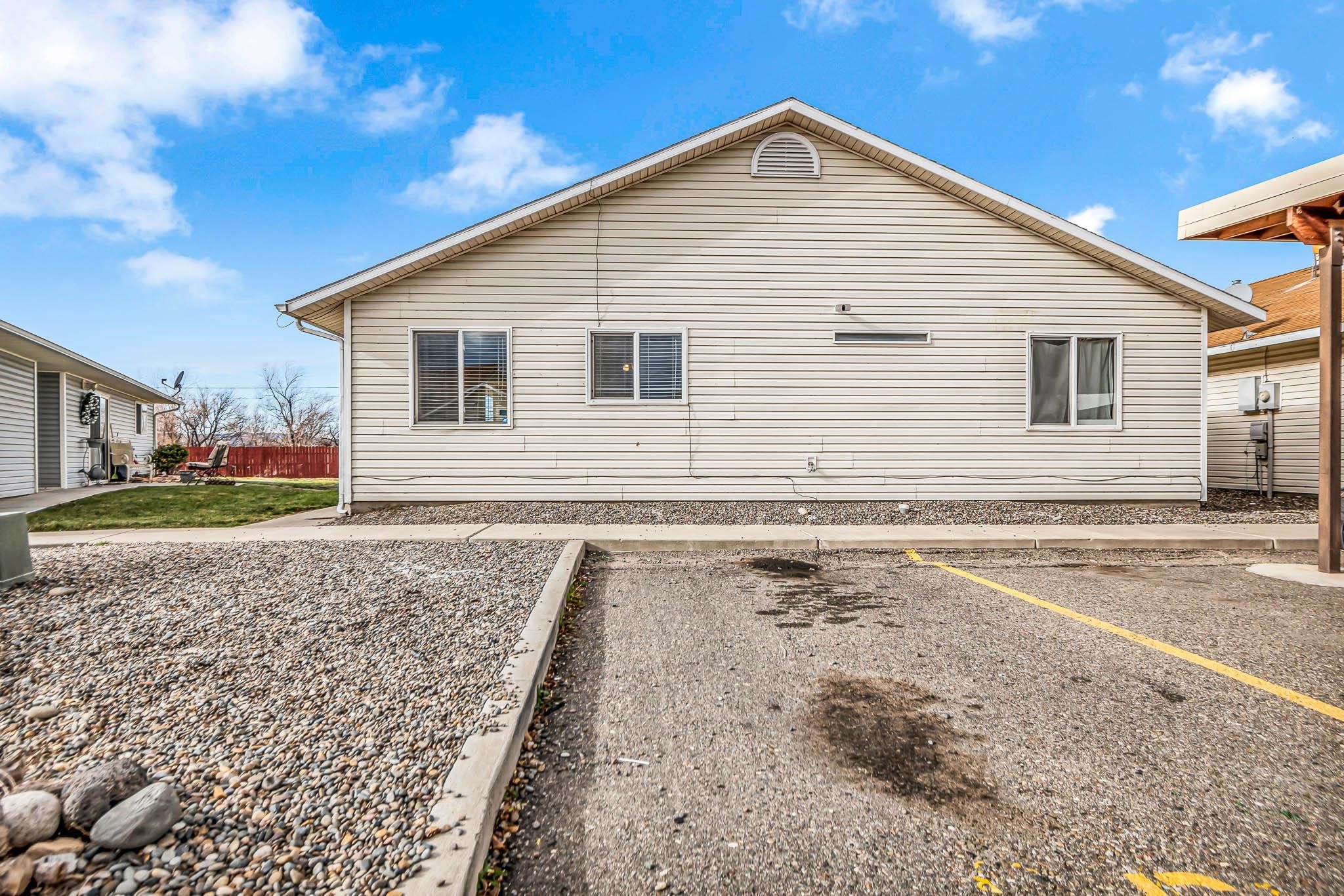 389 Sunnyside Circle, Unit A Grand Junction, CO 81504 - Photo 2 of 21 a view of a house with a yard