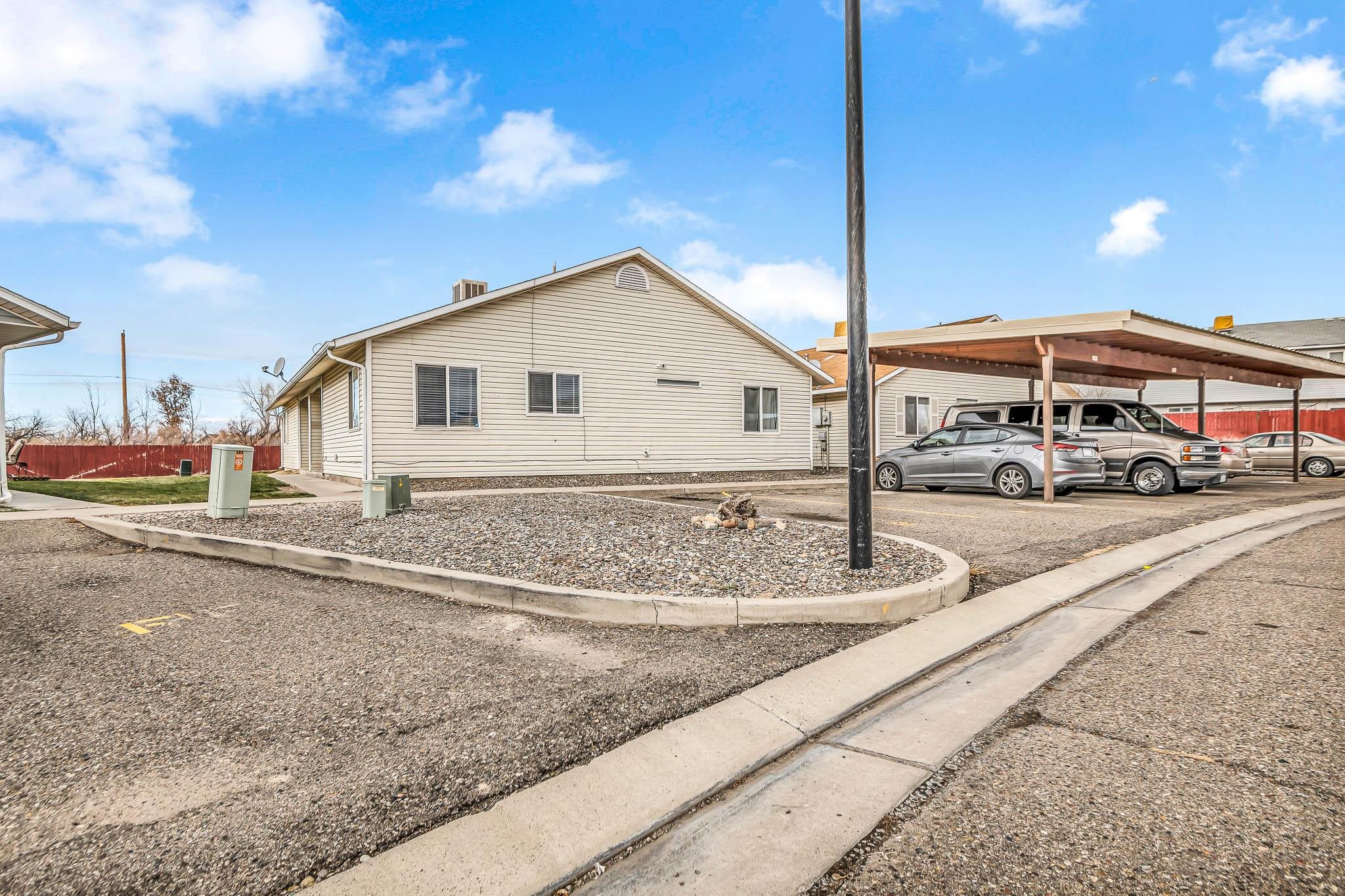 389 Sunnyside Circle, Unit A Grand Junction, CO 81504 - Photo 4 of 21 a front view of a house with a yard