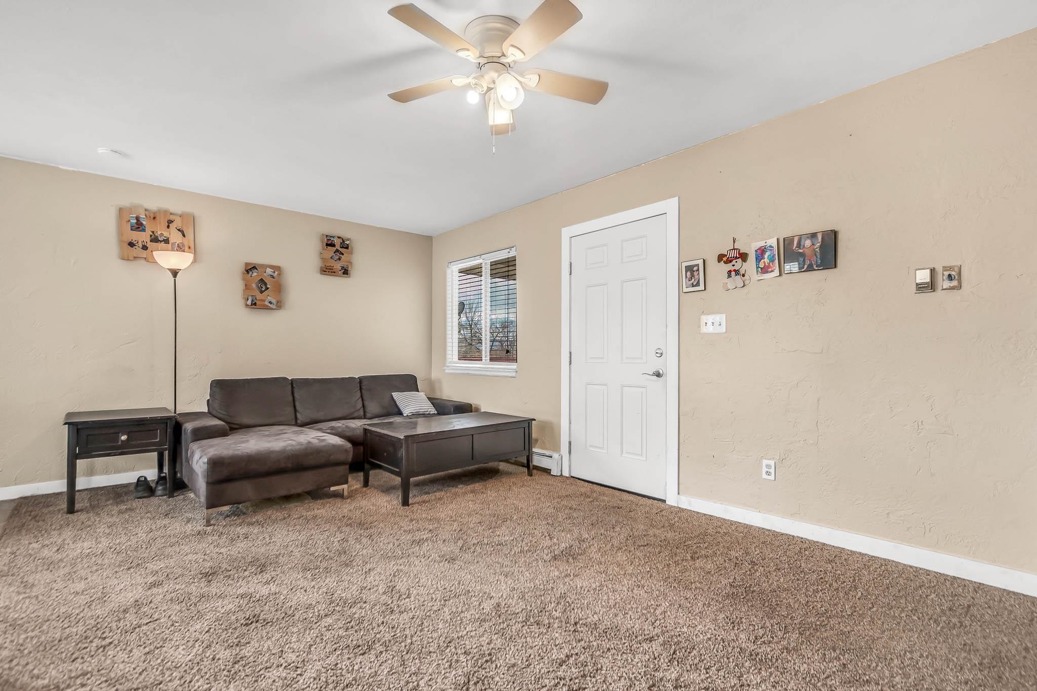 389 Sunnyside Circle, Unit A Grand Junction, CO 81504 - Photo 6 of 21 a living room with furniture and a window
