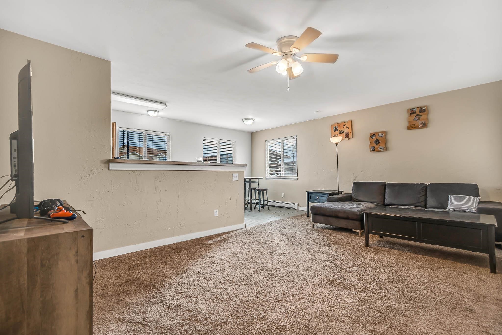 389 Sunnyside Circle, Unit A Grand Junction, CO 81504 - Photo 8 of 21 a living room with furniture and a window