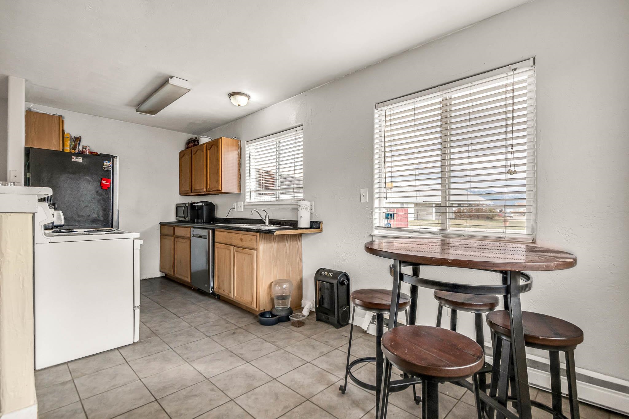 389 Sunnyside Circle, Unit A Grand Junction, CO 81504 - Photo 9 of 21 a kitchen that has a cabinets counter space and appliances