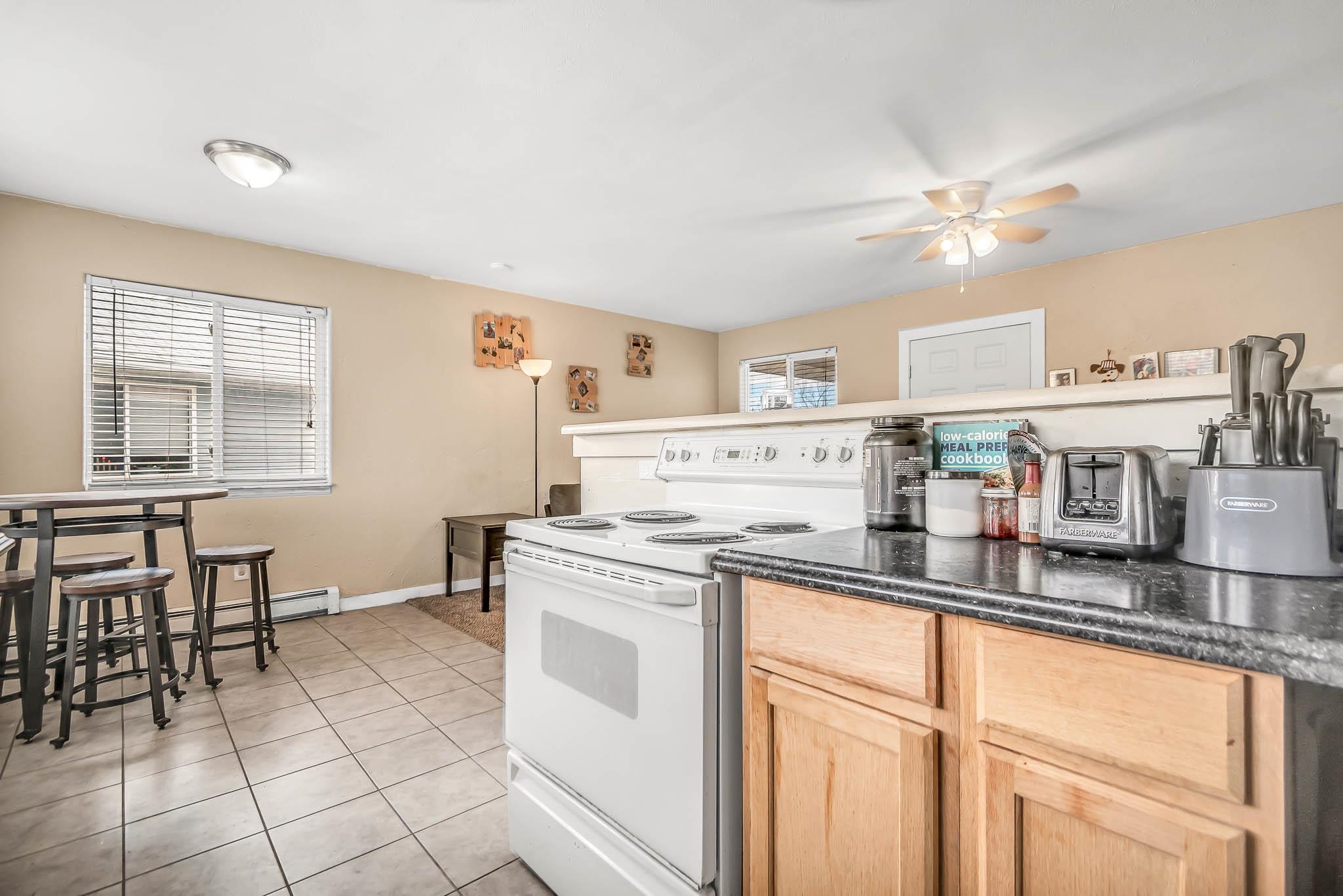389 Sunnyside Circle, Unit A Grand Junction, CO 81504 - Photo 10 of 21 a kitchen with stainless steel appliances granite countertop a sink and cabinets