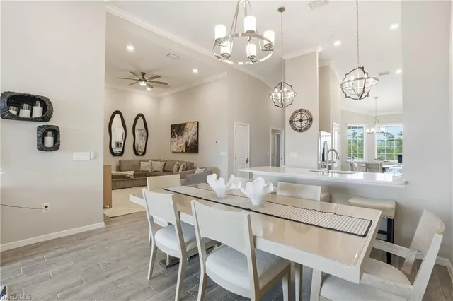 a kitchen with a table and chairs in it