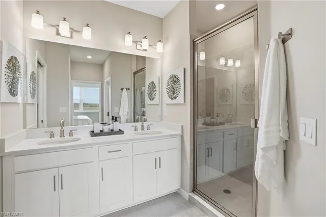 a bathroom with a shower sink double and mirror