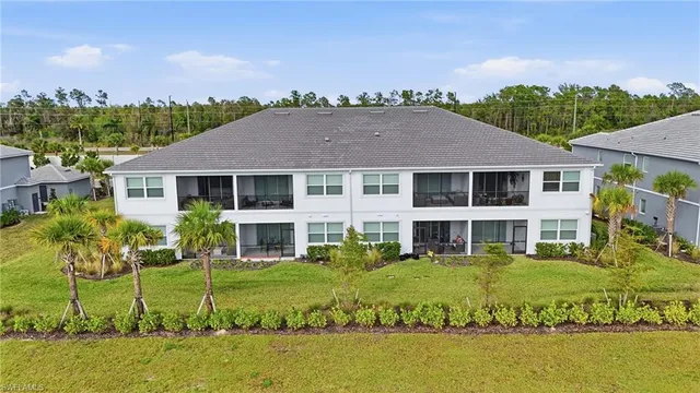 a view of a house with swimming pool and a yard