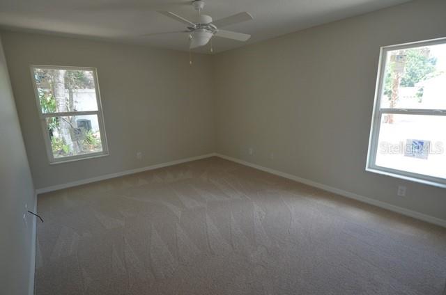 641 Constance Road Venice, FL 34293 - Photo 11 of 14 an empty room with a window