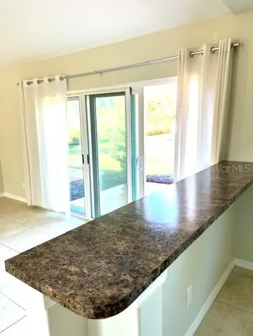 a kitchen with a stove sink and refrigerator