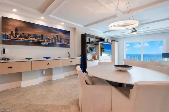 a kitchen with stainless steel appliances granite countertop a sink and a refrigerator