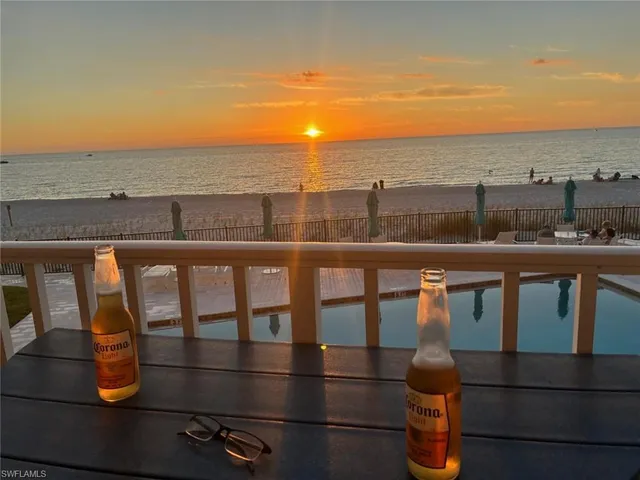 a picture of a bench in front of a wall