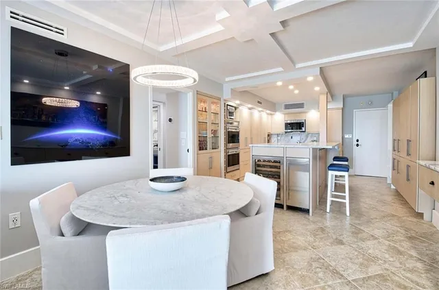 a kitchen with stainless steel appliances kitchen island granite countertop a sink and cabinets