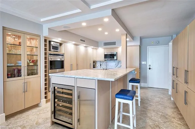a kitchen with a stove a refrigerator and a sink