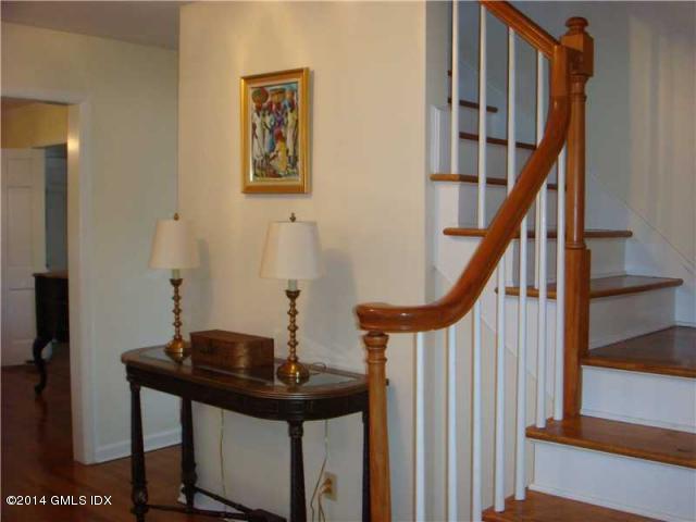16 MacKenzie Glen Greenwich, CT 06830 - Photo 11 of 26 a view of entryway with wooden floor and furniture